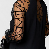 Bellezza Vestido Negro con Mangas de Malla Colección Premium